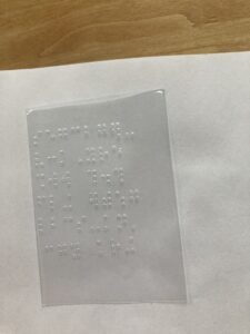 Braille labeled sleeve.